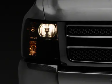 Raxiom 07-14 Chevrolet Silverado 1500 HD Axial OEM RepHeadlights- Chrome Housing- Smoked Lens - S122324 While Supplies Last